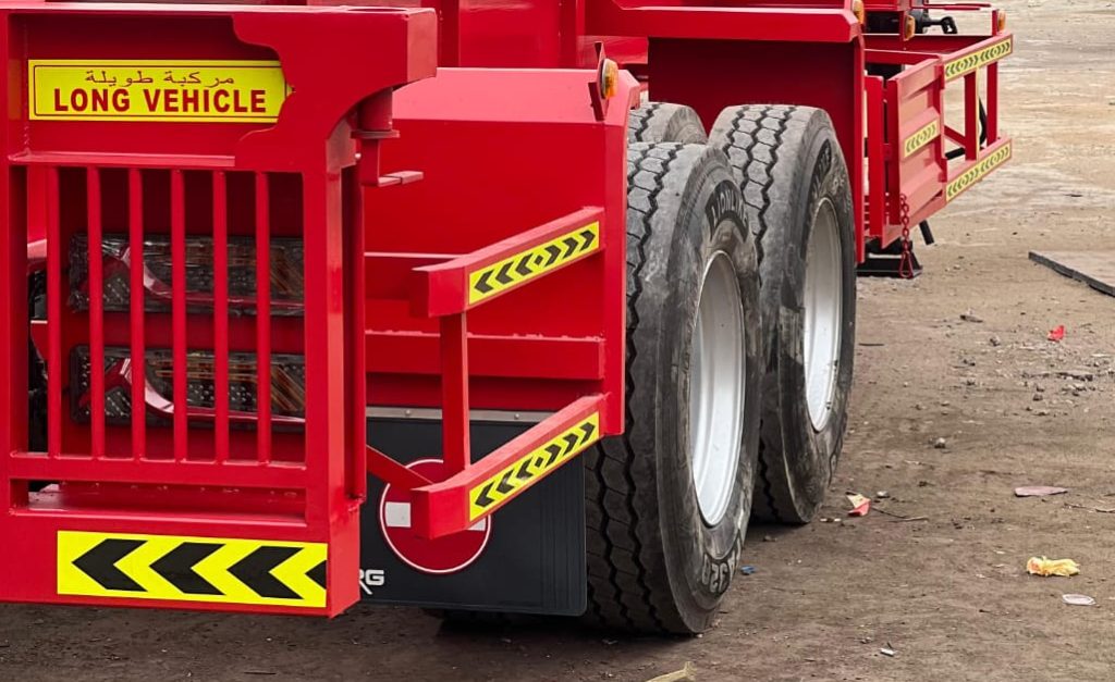 "Lowbed trailer transporting heavy machinery in the UAE"